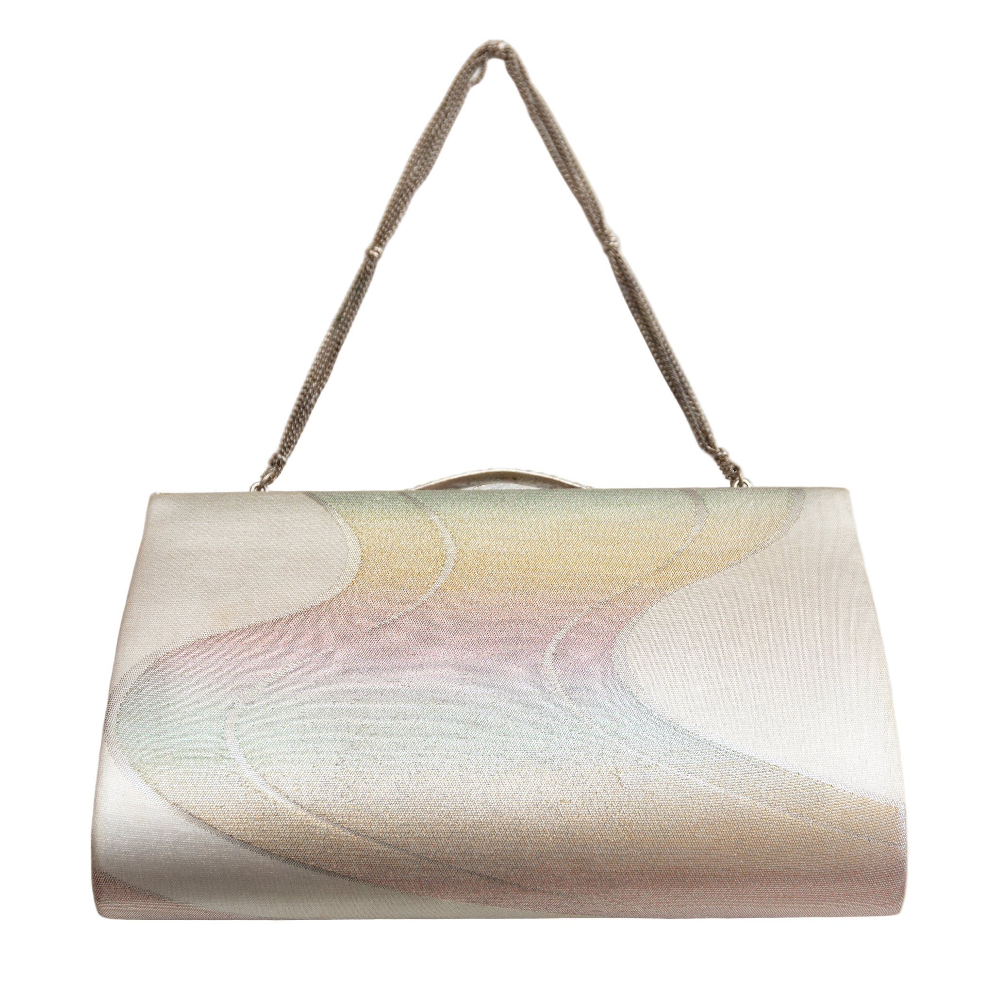 Reverse view of vintage Japanese silk clutch bag in rainbow river design, silver strap on white background.