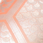 Close-up of the Peach Cream Kimono Bolster Pillow’s oyster back fabric highlighting its smooth texture and subtle sheen