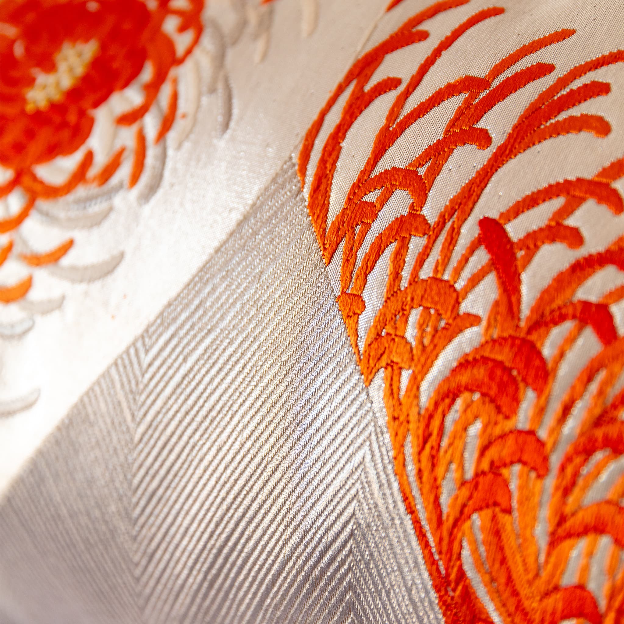 Flame orange spider chrysanthemum against silver geometric zigzag ground, vintage Japanese Fukuro Obi silk detail
