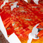 Close up of the edge of the vintage kimono silk throw which shows the original collar of the kimono incorporated into the design on the throw
