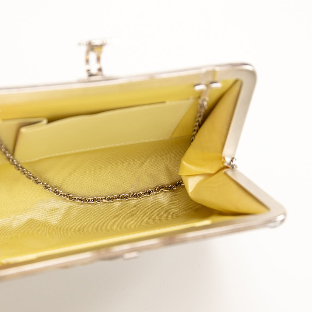 Interior view of the vintage silk Japanese clutch bag showing the silver chain strap tucked inside
