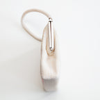 Side view of vintage Japanese beaded handbag showing structured shape and metal closure 