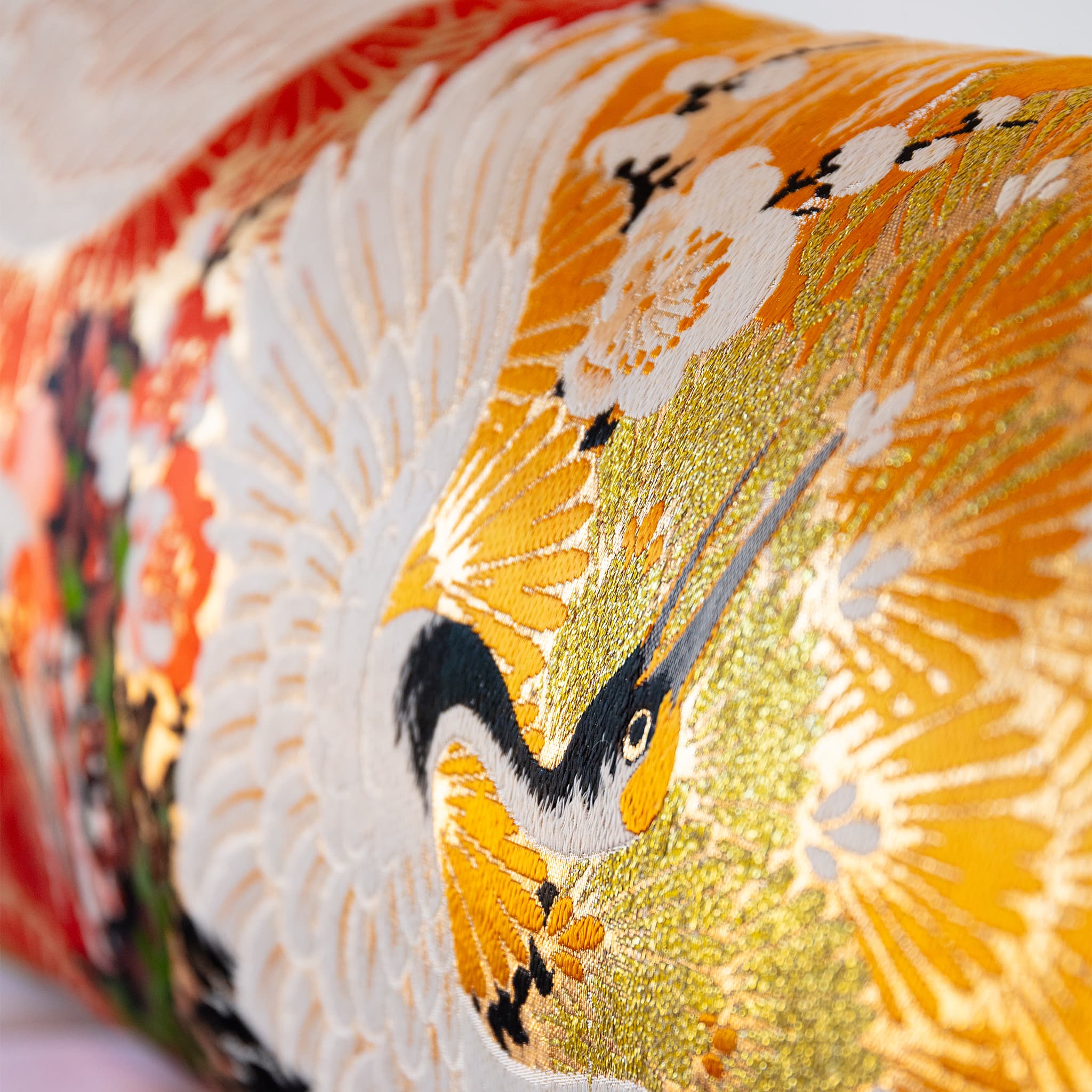 Soaring white crane and plum blossom detail, vintage Japanese Maru Obi silk bolster cushion
