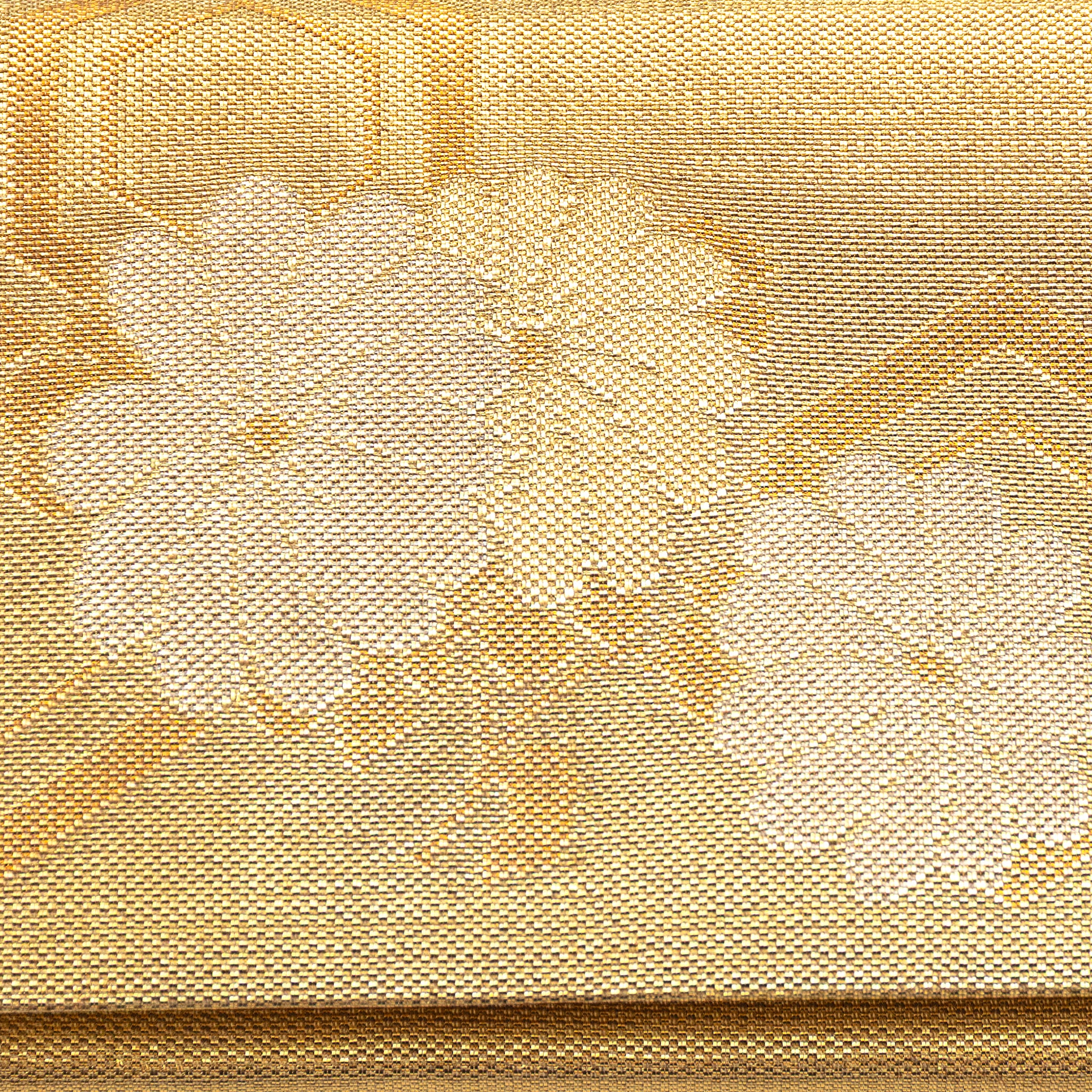 Close up of woven metallic gold silk flowers pattern on the front of a vintage Japanese silk clutch bag.