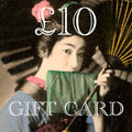 Hunted and Stuffed gift card with embossed logo, rectangular shape, textured paper, black and white design, 4x6 inches