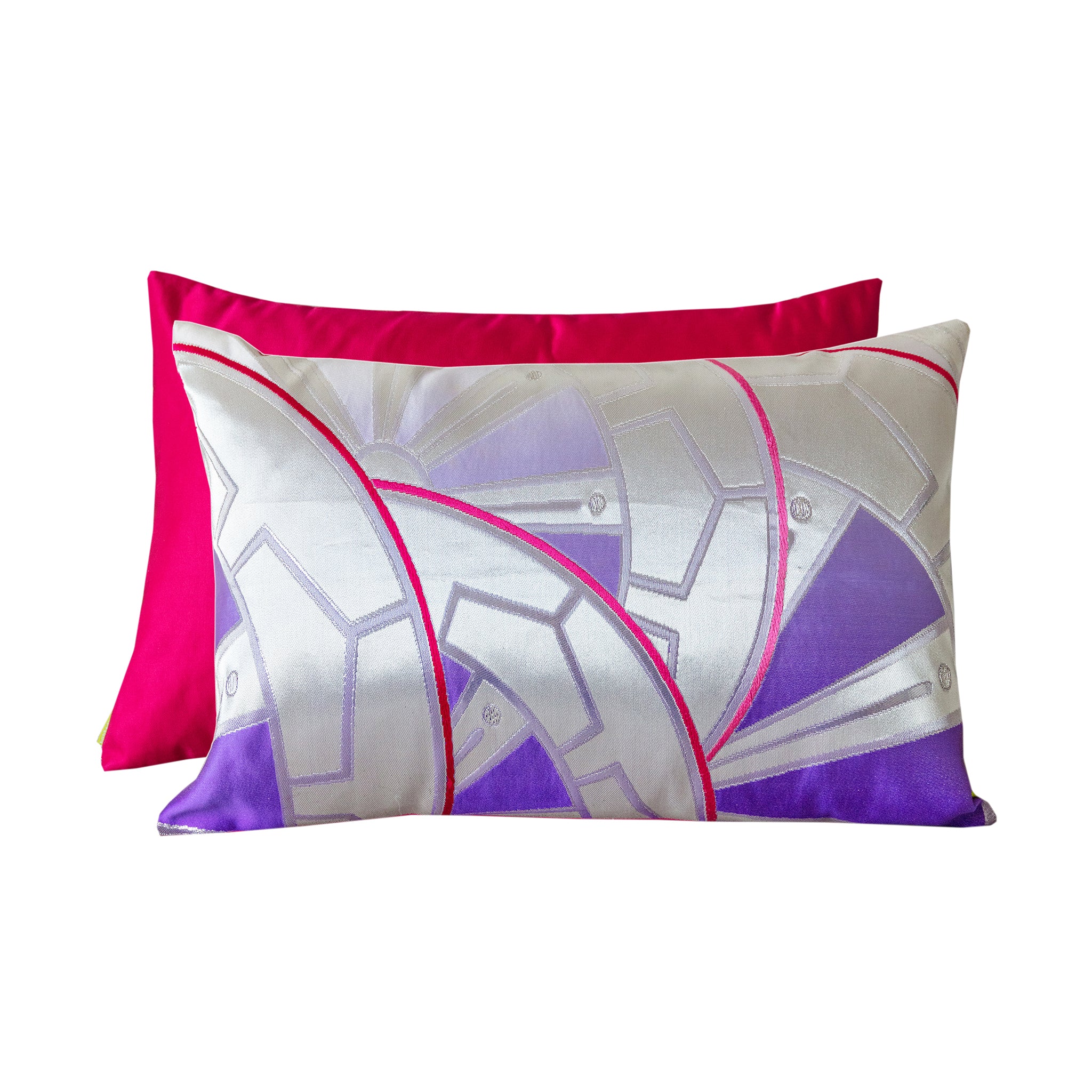 Purple rectangular Japanese obi silk pillow with a bright pink silk back, on white background.