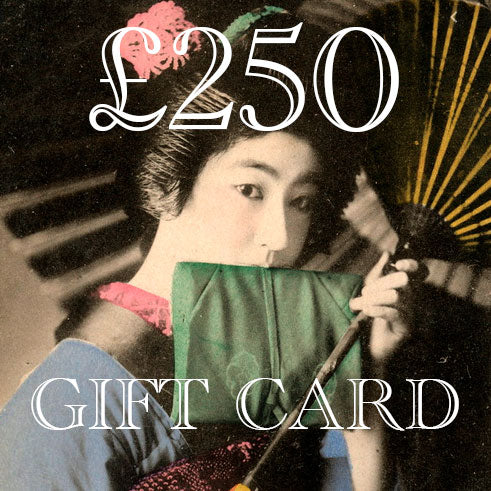 Close-up of the textured, black velvet surface with subtle stitching details on the Hunted and Stuffed gift card pack