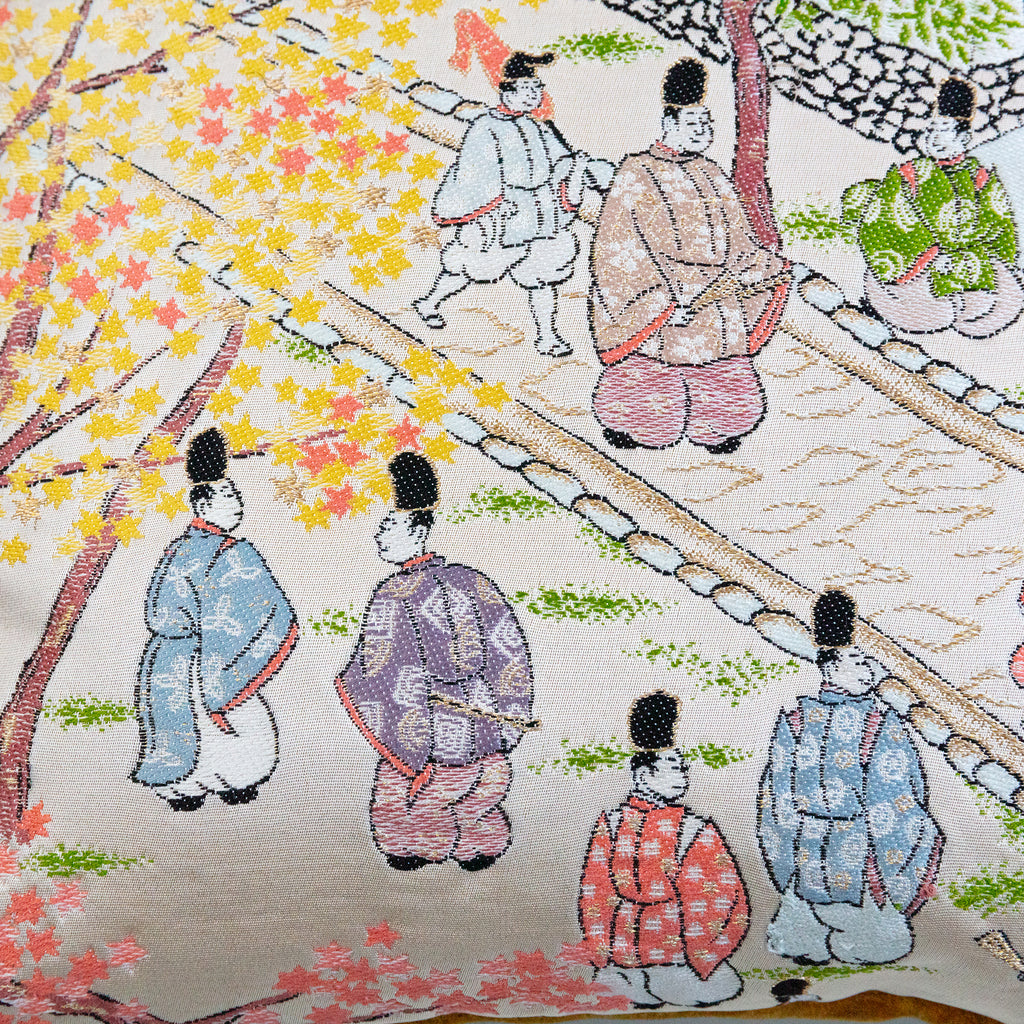 Close-up of vibrant Nishijin silk fabric highlighting intricate woven patterns and rich texture on the 14-inch Obi Pillow