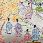 Close-up of vibrant Nishijin silk fabric highlighting intricate woven patterns and rich texture on the 14-inch Obi Pillow