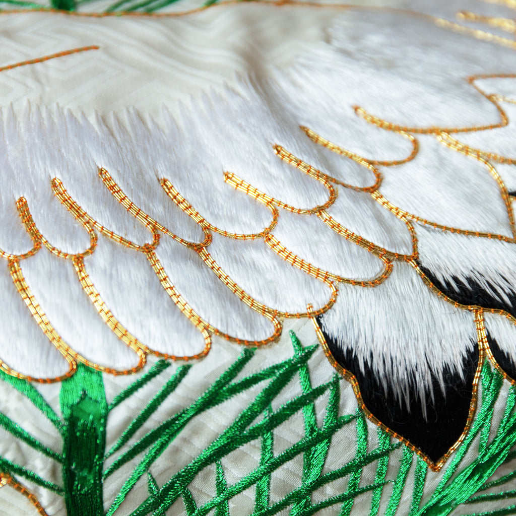 silk throw made from vintage kimono silk, detail of white embroidered crane with gold couchwork and green pines