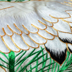 silk throw made from vintage kimono silk, detail of white embroidered crane with gold couchwork and green pines