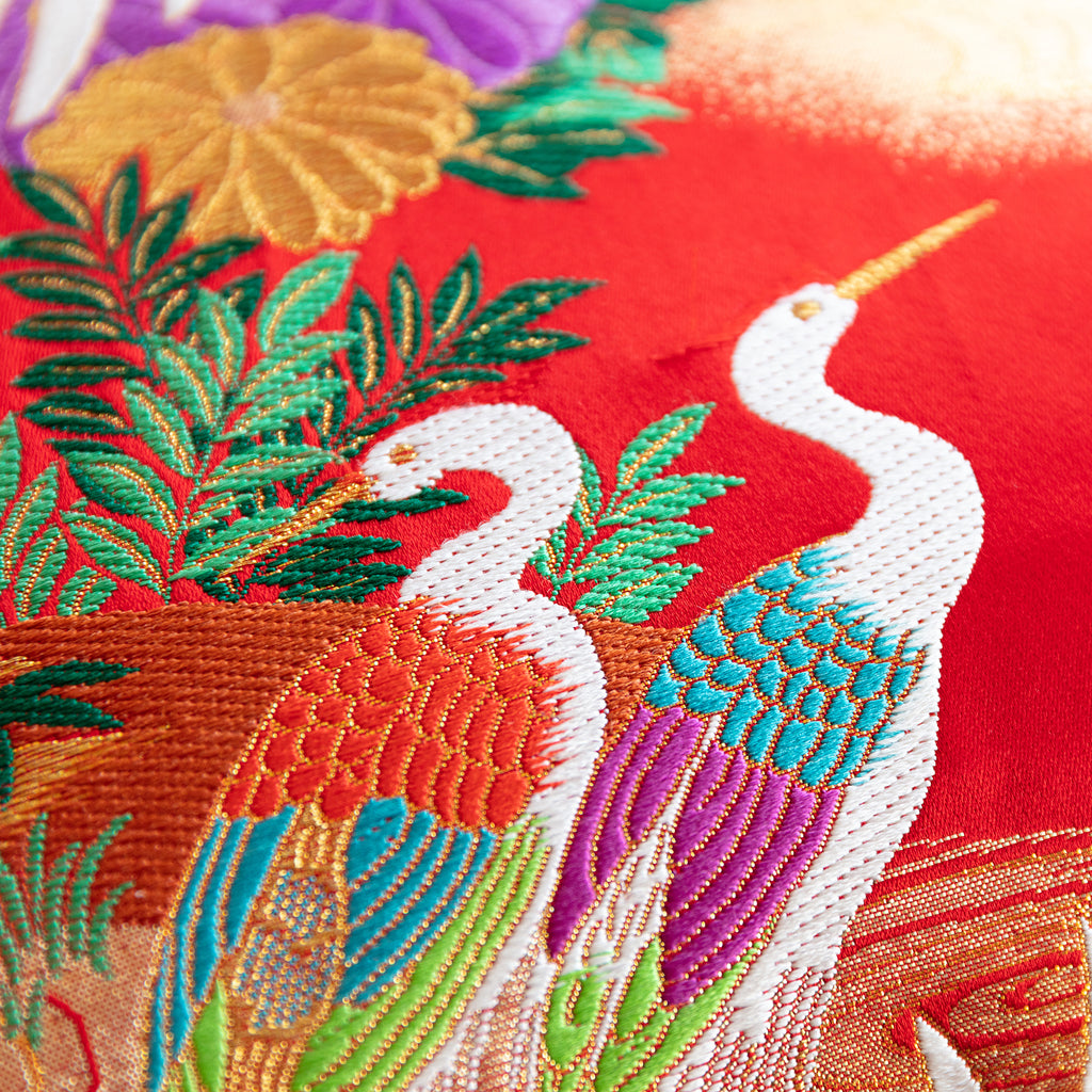 Close-up of the red silk upholstery with intricate black velvet embroidery on the Wedding Uchikake square cushion, 16-inch