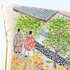 Close-up of vibrant Nishijin silk textile highlighting intricate woven floral patterns and rich color details on the Obi