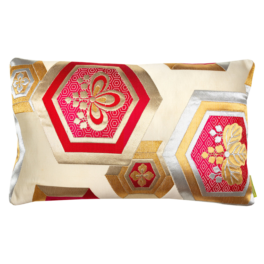 A cream silk obi pillow with metallic gold and silver hexagons and red Kiri floral embroidery by Kimono Living.