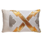 A cream silk pillow with gold and silver geometric accent embroidery made from a vintage Japanese silk obi.