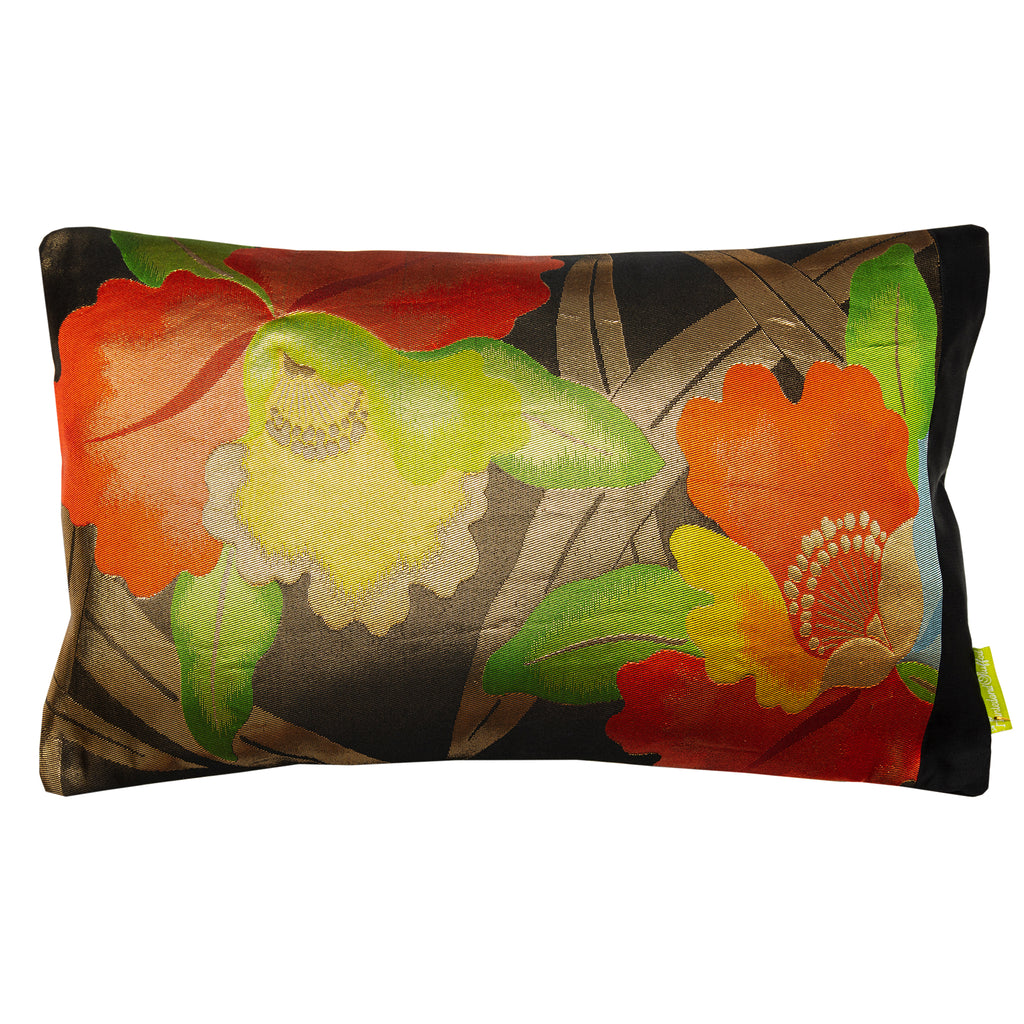 A black silk throw pillow with a floral pattern in red, yellow, and gold colors and a black border.