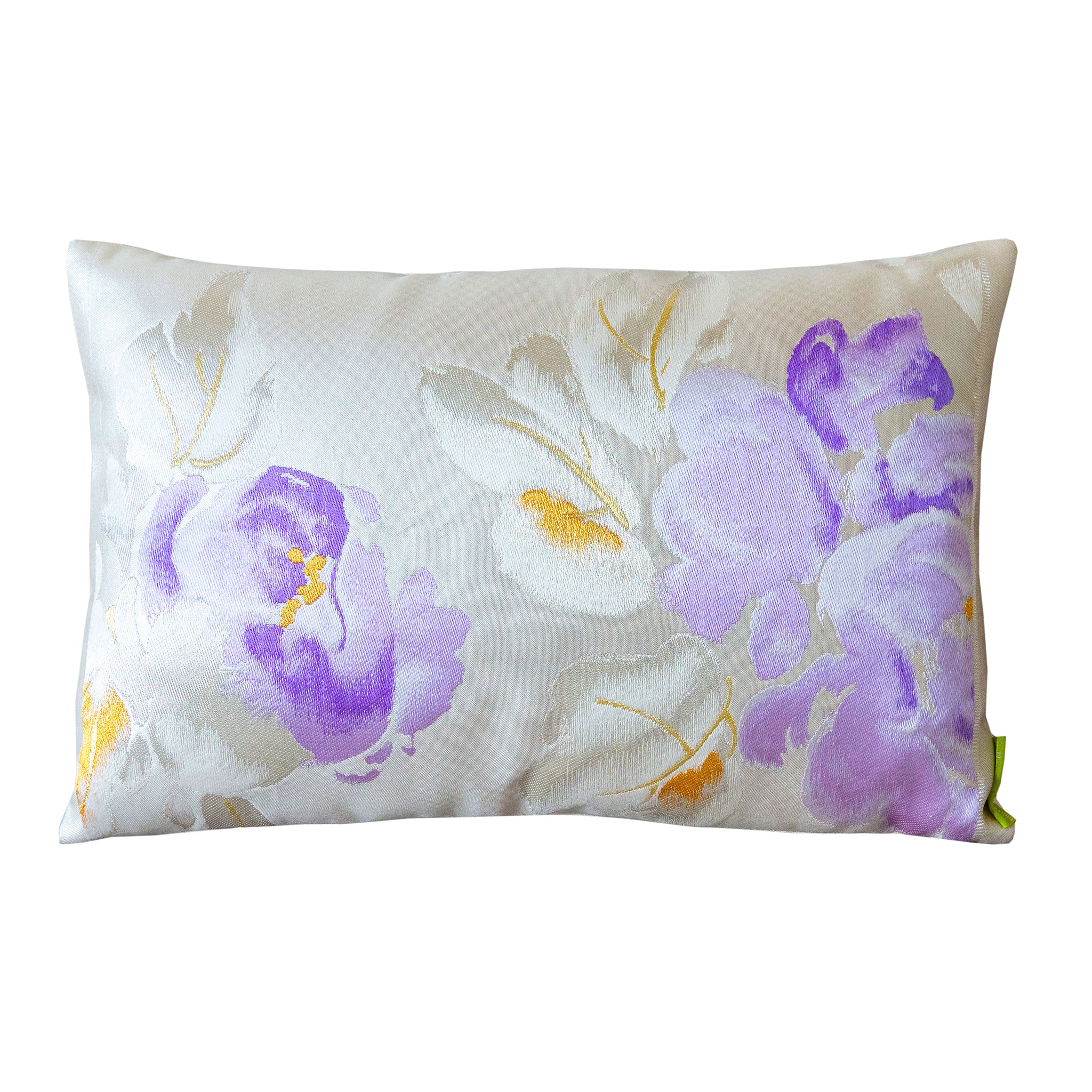 A rectangular vintage Japanese obi silk cushion with purple and silver floral embroidery and peony design, on a light background.