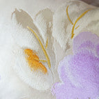 Close up of camilla flower obi silk in cream, lilac and gold.