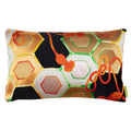 A rectangular decorative pillow with a black silk base featuring a gold hexagon pattern and accents in silver, green, orange, and yellow silk threads.