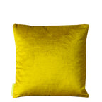 Close-up of the gold geometric embroidery detail on the chartreuse velvet Obi pillow’s textured surface