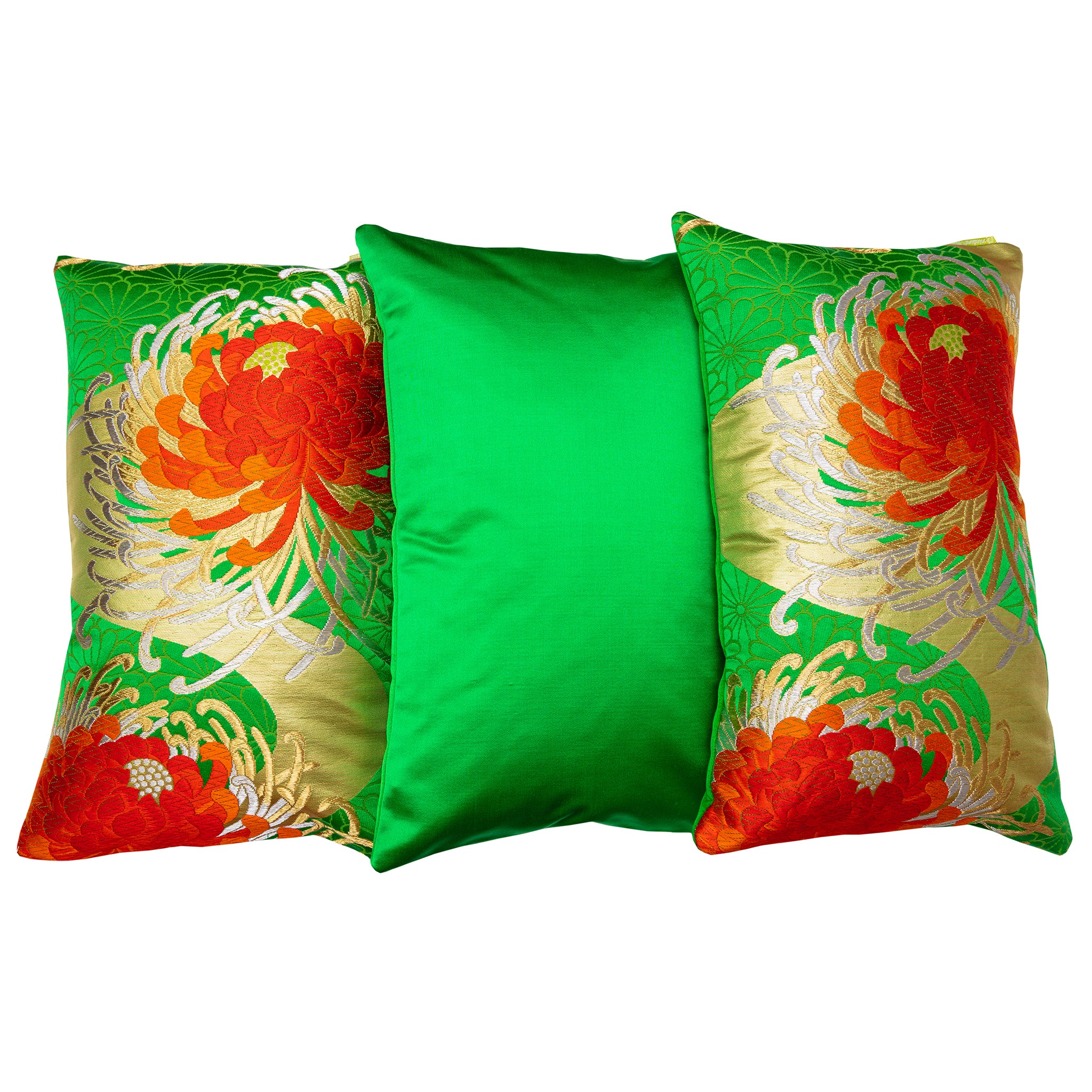 Close-up of red floral silk obi cushion fabric's intricate embroidery and glossy silk texture from a diagonal angle.