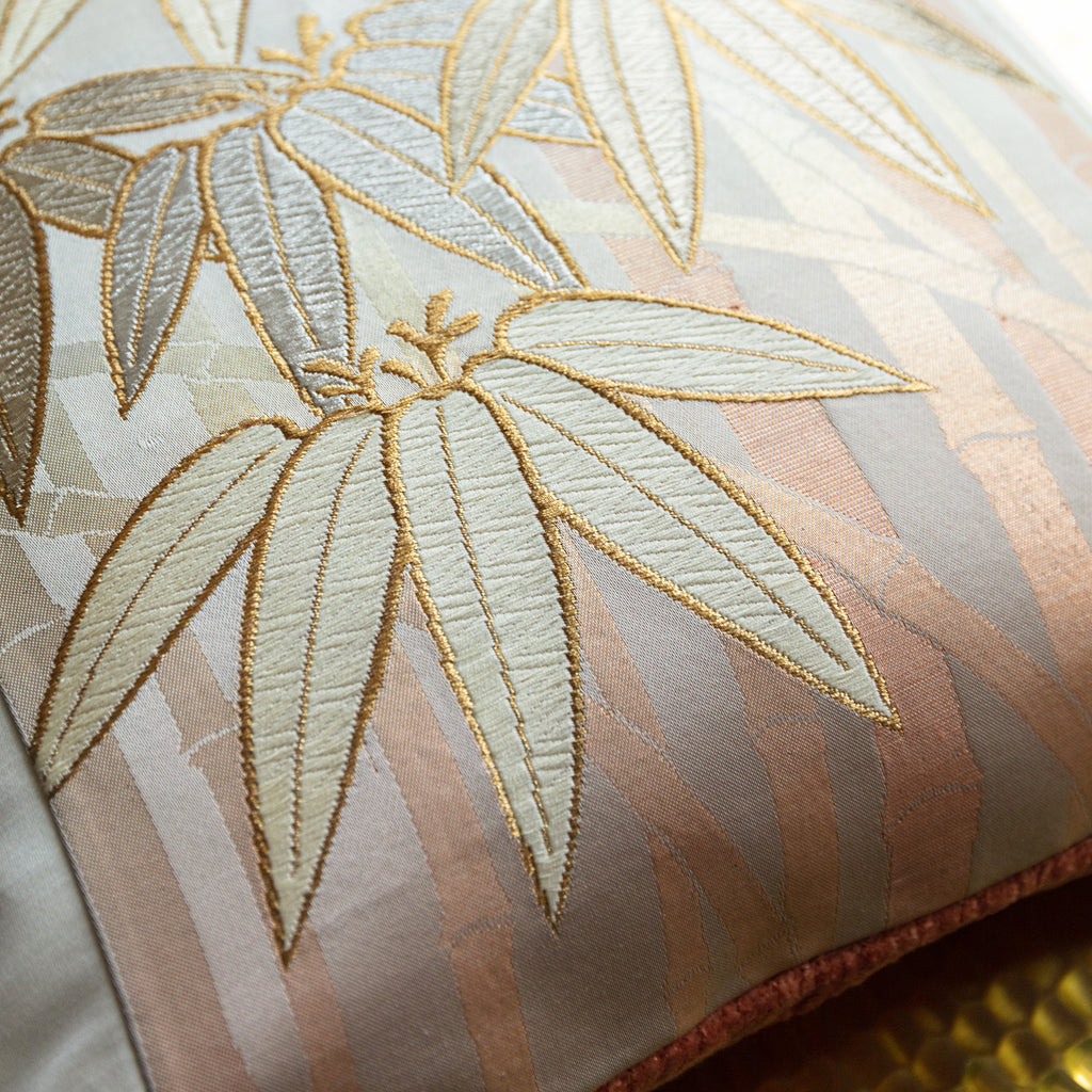 Close-up of the bamboo weave detailing on the gold finish, highlighting intricate craftsmanship and textured surface.