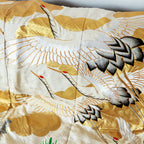 cream and gold silk throw made from vintage kimono silk, flying cranes over gold clouds pattern, close up