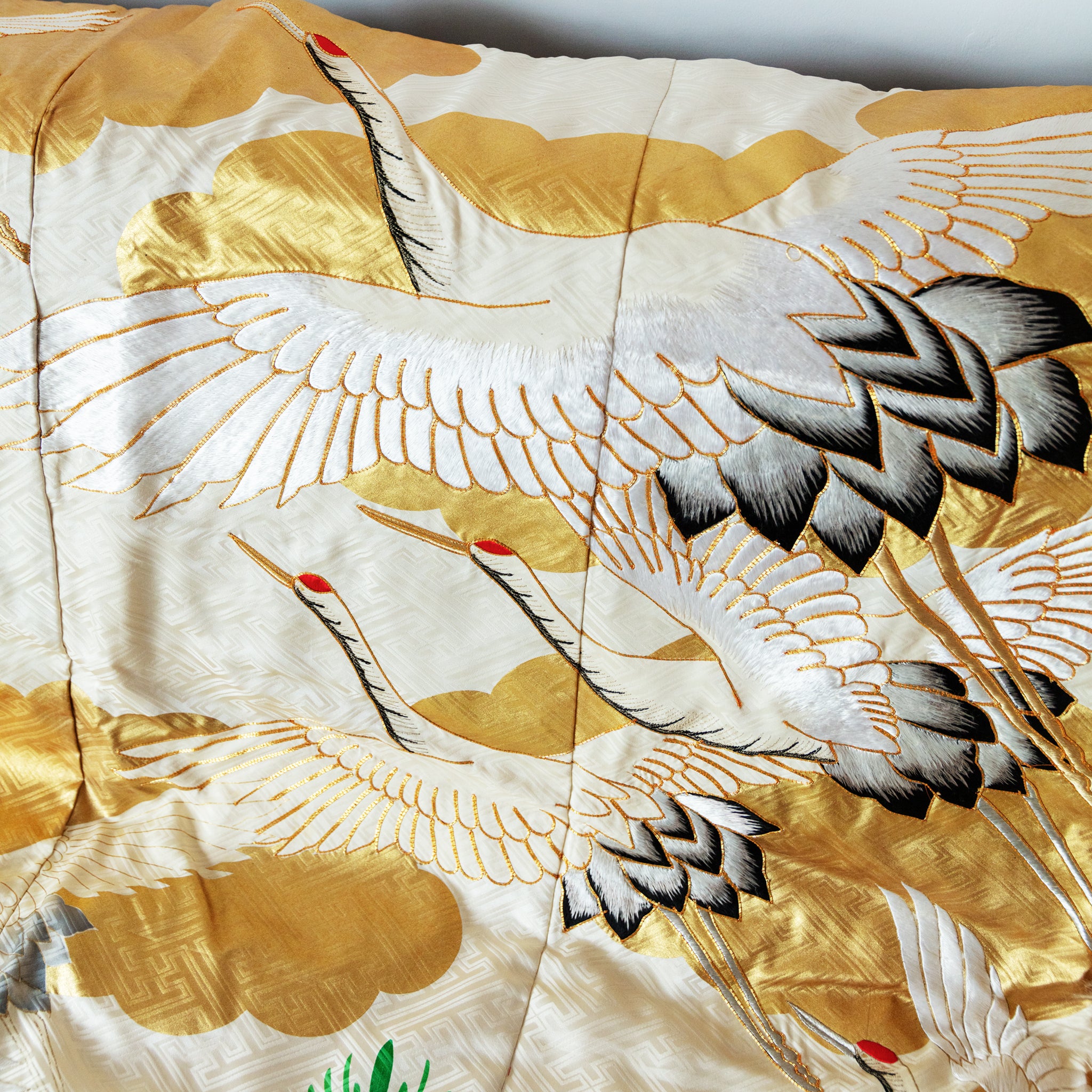 cream and gold silk throw made from vintage kimono silk, flying cranes over gold clouds pattern, close up