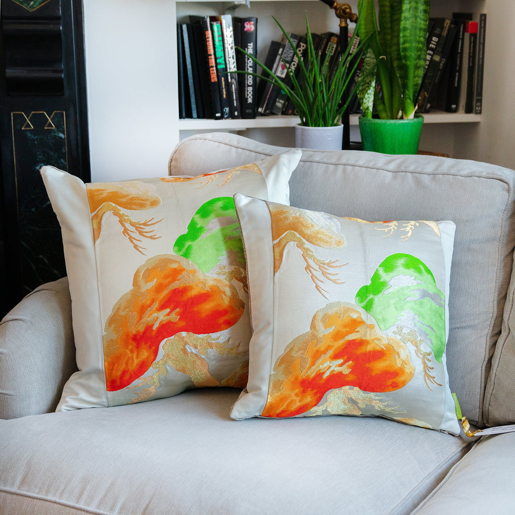 Close-up of the velvety velvet back and intricate Matsu Obi silk embroidery on the 19-inch cream pillow corner detail