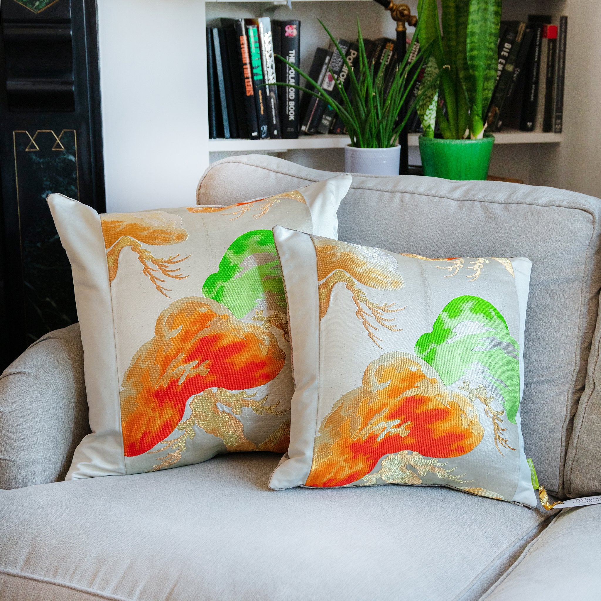 Close-up of the velvety velvet back and intricate Matsu Obi silk embroidery on the 19-inch cream pillow corner detail