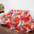 silk throw made from vintage kimono silk uchikake, multicolour flowers, white cranes on red draped on sofa