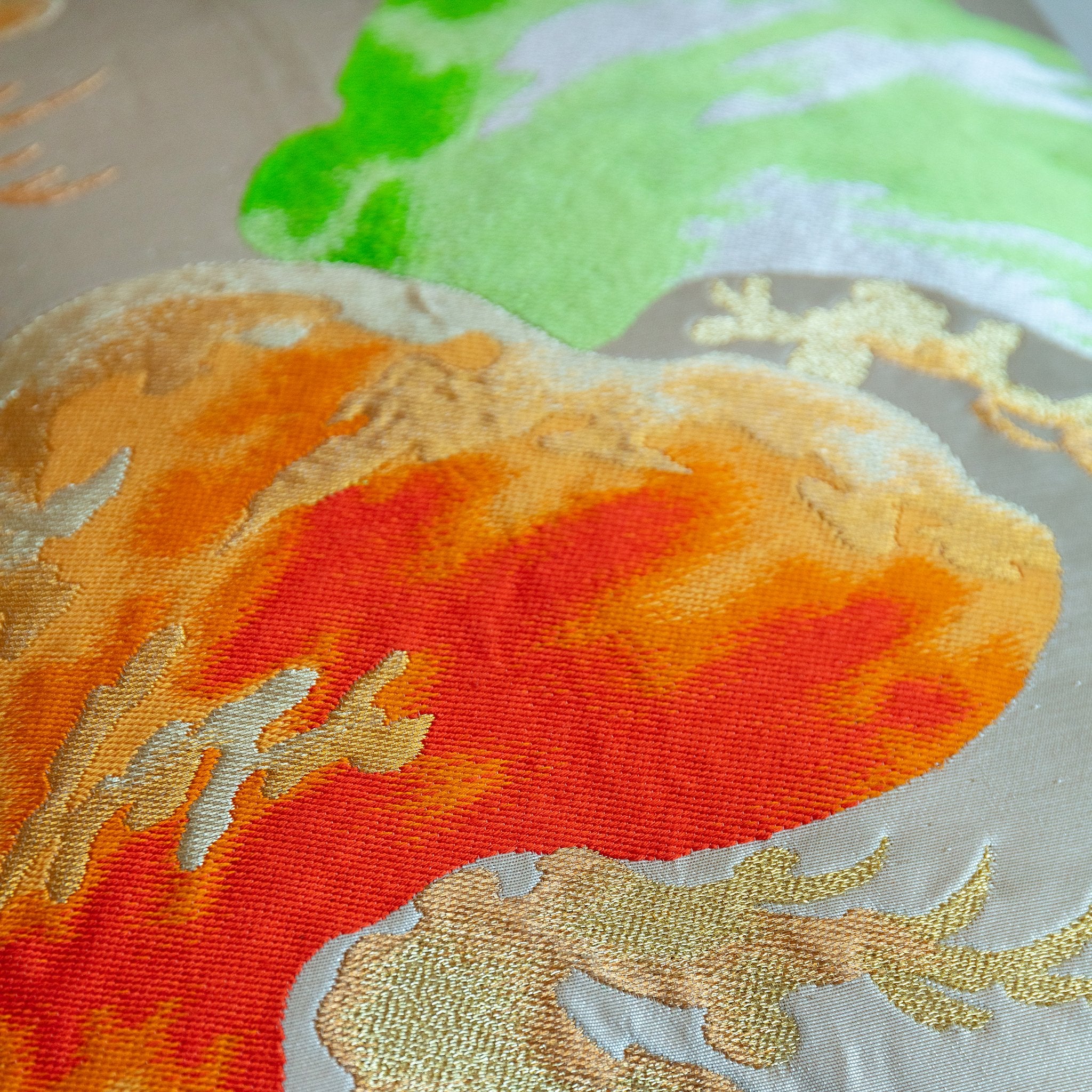 Close-up of cream velvet back showing soft texture and subtle sheen of Matsu Obi silk fabric on the pillow edge