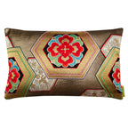 A gold accent pillow made from a vintage Japanese obi silk with fortune hexagons and red floral pattern.