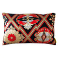 A vintage Japanese silk kimono cushion with black, gold, and red colors featuring geometric patterns and stylized floral and phoenix designs.