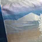 Close up detail of the silver mountains on the vintage blue silk obi cushion