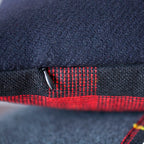 Close-up of navy wool tartan pattern highlighting textured fibers and crisp weaving detail on the Harold cushion cover.