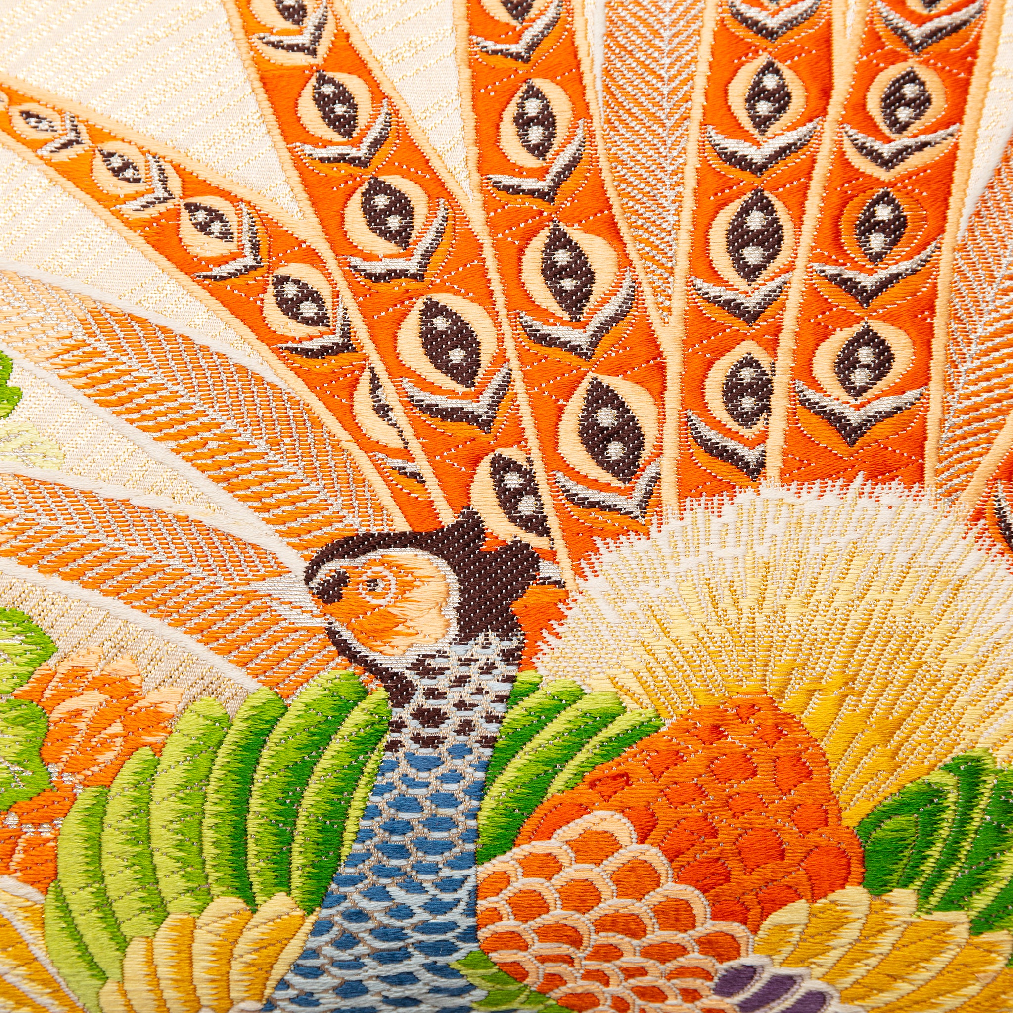 Close-up of cream Maru Obi silk fabric with intricate stitching and subtle sheen on the cushion's edge detail