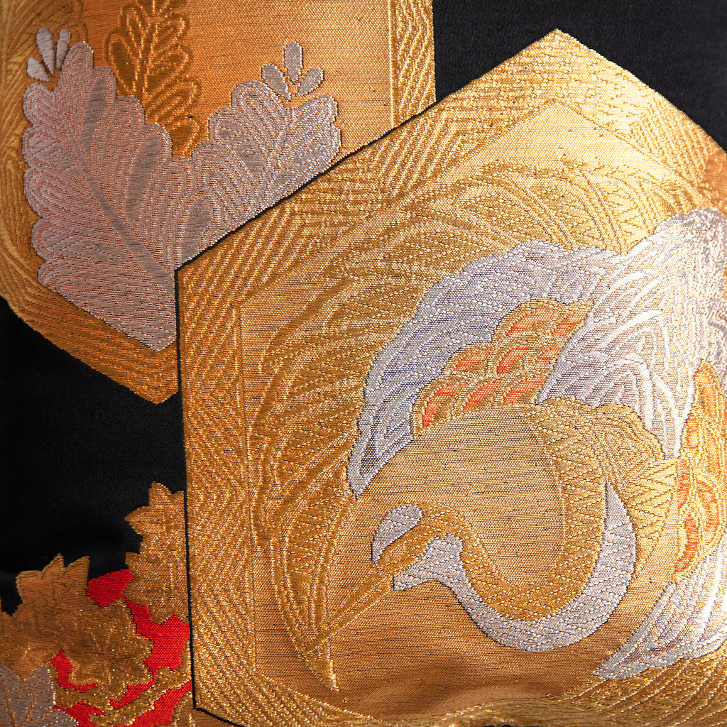 gold and silver crane motif in hexagon on black silk, detail of vintage Japanese obi pillow.
