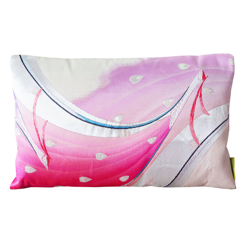 A rectangular silk cushion with a vintage Japanese obi design featuring peacocks in pink and silver colors on a cream silk reverse.