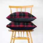 Close-up of navy wool tartan pattern highlighting intricate weaving and rich texture on the Harold Ltd Edition cushion cover.