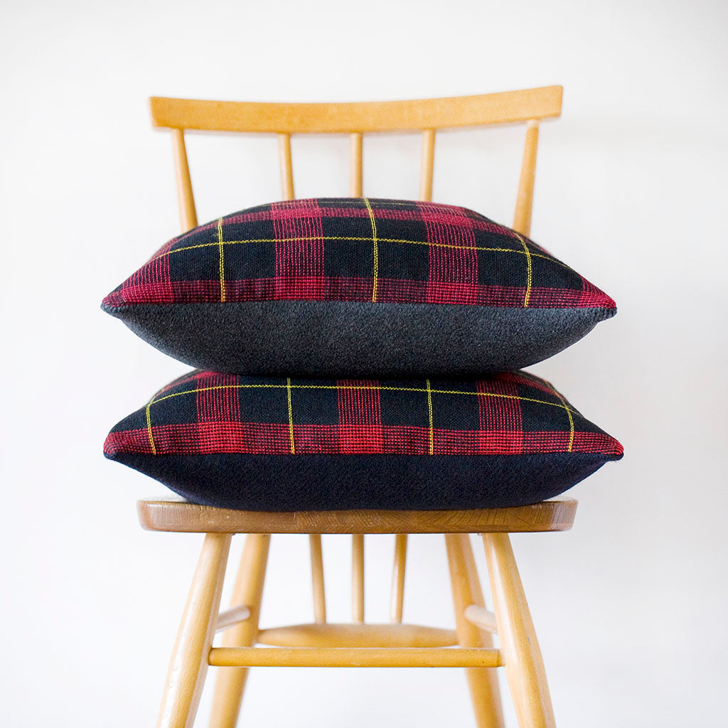 Close-up of grey wool tartan pattern highlighting vintage 1960s Gannex fabric texture and muted color palette