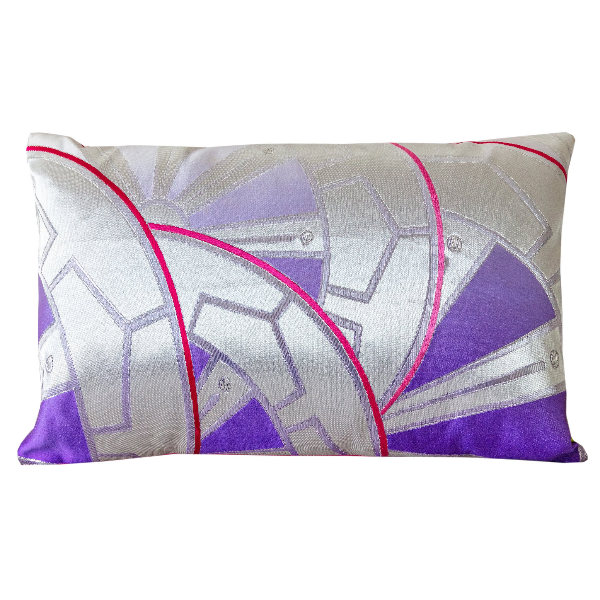 A vintage silver and purple Japanese obi cushion with a geometric Genji wheels design and a pink silk back.