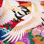 Close-up of red silk embroidery detailing on the black velvet surface of the 16-inch Wedding Uchikake cushion, highlighting