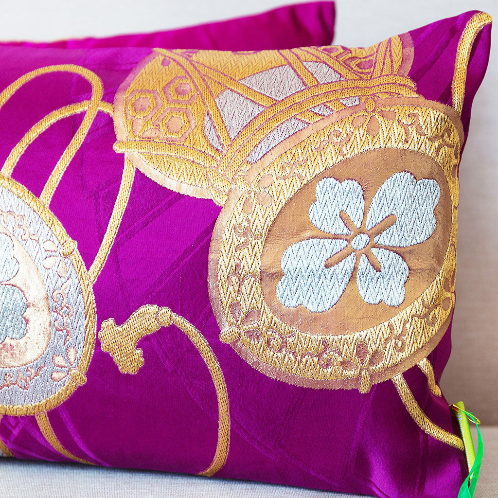 Golden drum Japanese obi cushion, detail of the metallic gold drum pattern over a woven purple fan silk base.